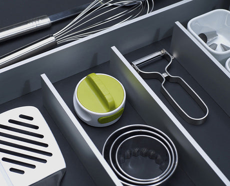 The Can-Do opener seated on top of a closed tin, ready to be twisted.