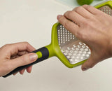 Close-up of the coarse blade surface on the green Twist Grater.