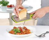 The Twist Grater standing on its non-slip feet on a worktop.