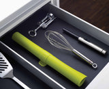 Rolled baking mat shown compact at 38 cm for drawer or hook storage.