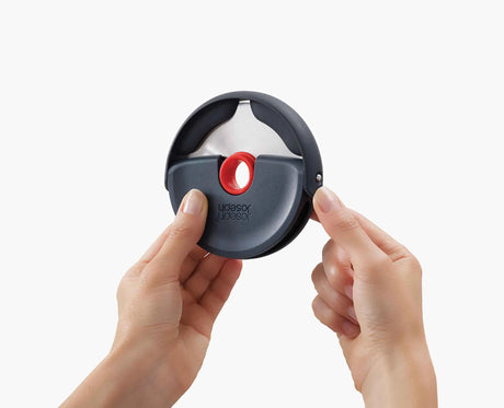The red silicone guard clipped over the blade for safe storage.