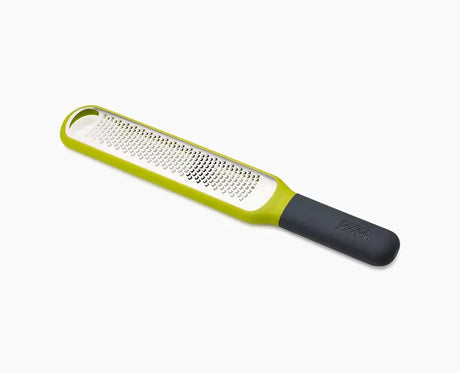 Joseph Joseph Handi-Zest citrus zester in green with its etched blade.