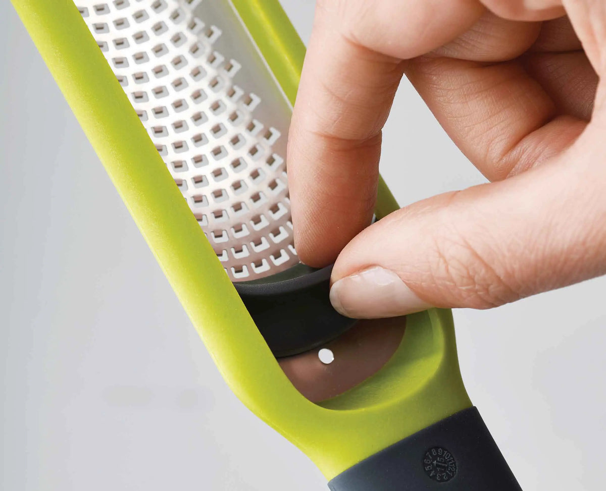 The protective sheath fitted over the zester blade for safe storage.