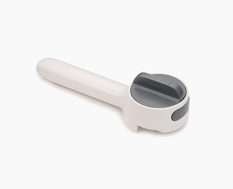 Joseph Joseph Can-Do Plus can opener in dark grey with its long handle.