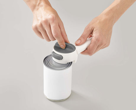 A hand turning the easy-twist mechanism of the Can-Do Plus.