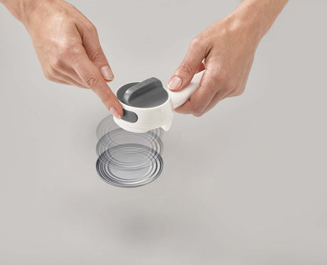 The integrated hook on the Can-Do Plus lifting a ring-pull tab.