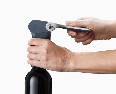 Close-up of an integrated foil cutter built into the corkscrew arm.