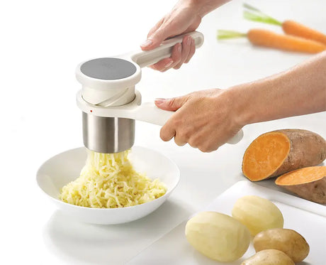 Joseph Joseph Helix potato ricer showing the twist action handle