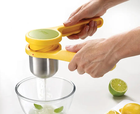 Joseph Joseph Helix citrus juicer in yellow twist action in use, Homelux Kenya