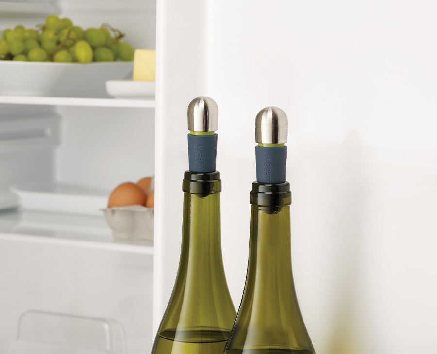 The wine stopper inserted into the neck of an open bottle.