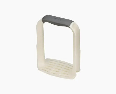 Joseph Joseph Easy-Mash potato masher in white with its D-shaped handle.