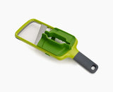 Joseph Joseph Multi-Grip Mandoline in green with its food grip attached.