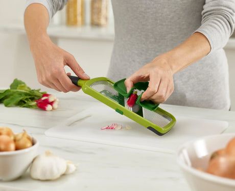 The precision food grip holding a vegetable in the centre grip position.