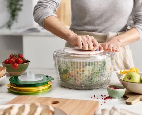 The four interchangeable Multi-Prep discs: salad spinner, spiraliser, slicer and grater.