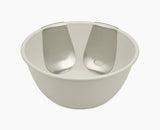 Joseph Joseph Uno salad bowl in stone with both stainless-steel servers hooked onto the rim.