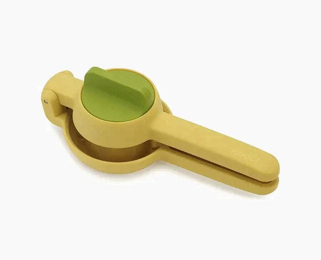 Joseph Joseph JuiceMax yellow citrus press shown closed.
