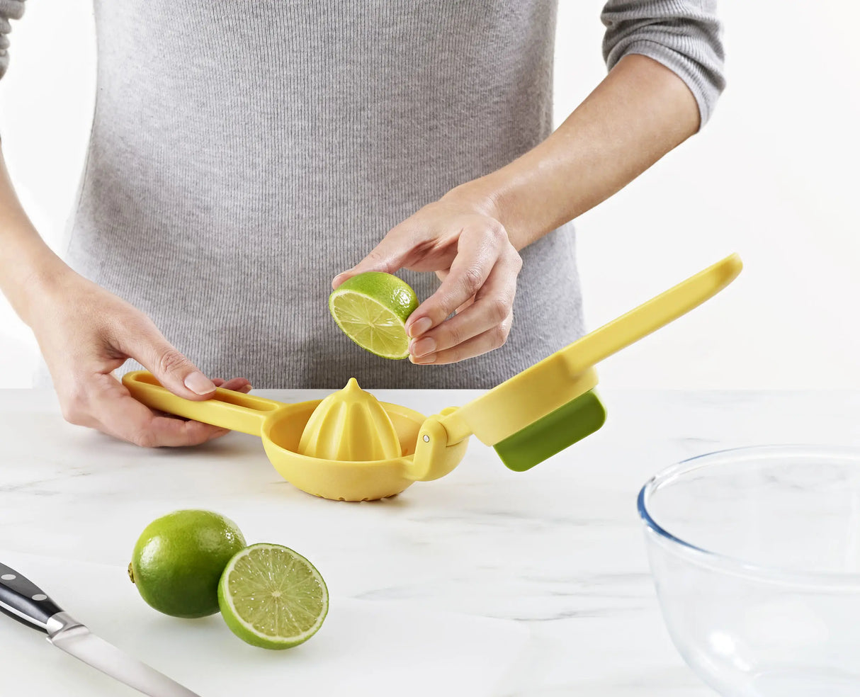 Close-up of the reamer twisting into citrus fruit.