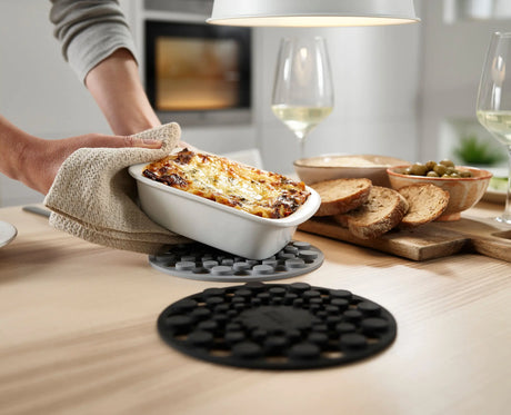 A hot pan resting on a Spot-On silicone trivet.