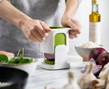 An onion being chopped with the ChopCup.