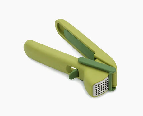 Joseph Joseph CleanForce green garlic press shown closed.