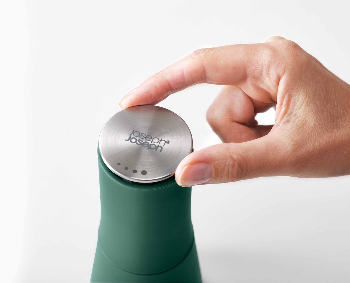 Joseph Joseph Milltop salt and pepper mill set in Editions sage green adjusting the stainless steel top, Homelux Kenya