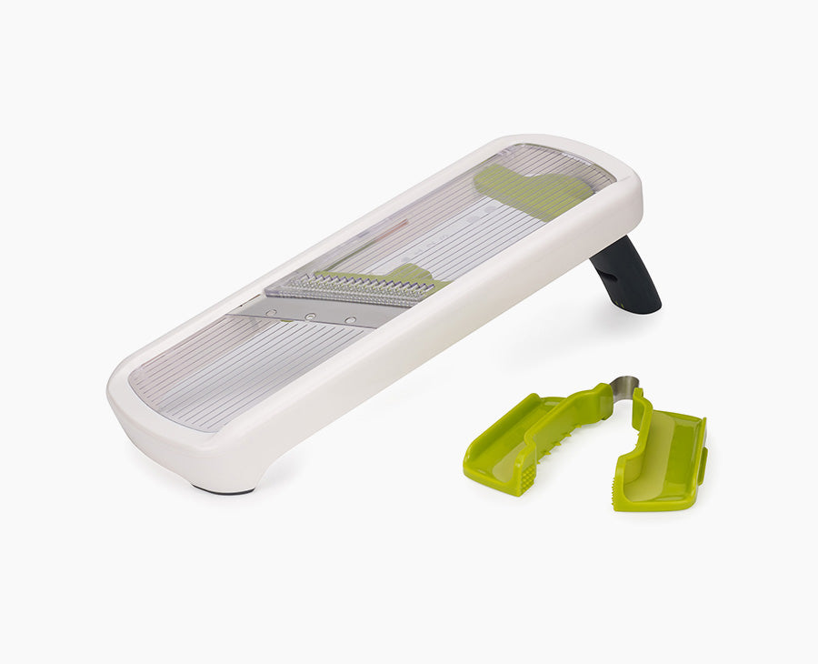Joseph Joseph Multi-Grip Mandoline Plus in white, set up for slicing.
