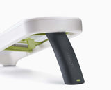 The mandoline's folding easy-grip handle and non-slip feet.