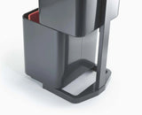Carrier bag hooks and liner retaining holes inside a Totem Max compartment.