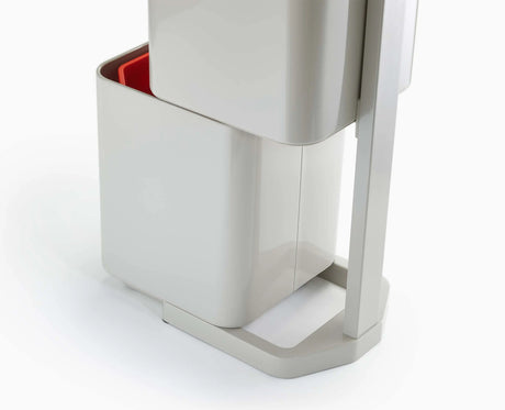 Liner retaining holes and carrier bag hooks inside a Totem Compact compartment.