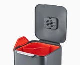 A 20 litre compartment lifted out of the graphite Totem Compact for emptying