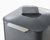 Replaceable carbon odour filter in the lid of the graphite Totem Compact