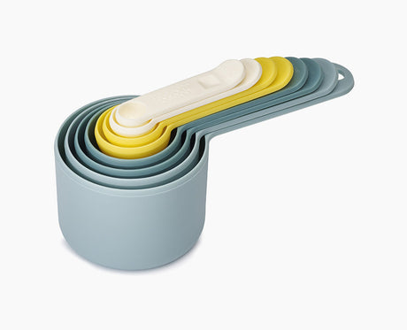 Joseph Joseph Nest Measure 8-piece measuring cup set in opal, stacked together as one block