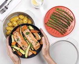 The four M-Cuisine pieces separated to show the 2L pot, steamer, griddle and lid
