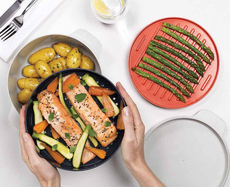 The four M-Cuisine pieces separated to show the 2L pot, steamer, griddle and lid