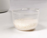 Close-up of the measuring cup used to portion out dry rice
