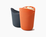 Joseph Joseph M-Cuisine 2-piece microwave popcorn maker set in orange with grey lids