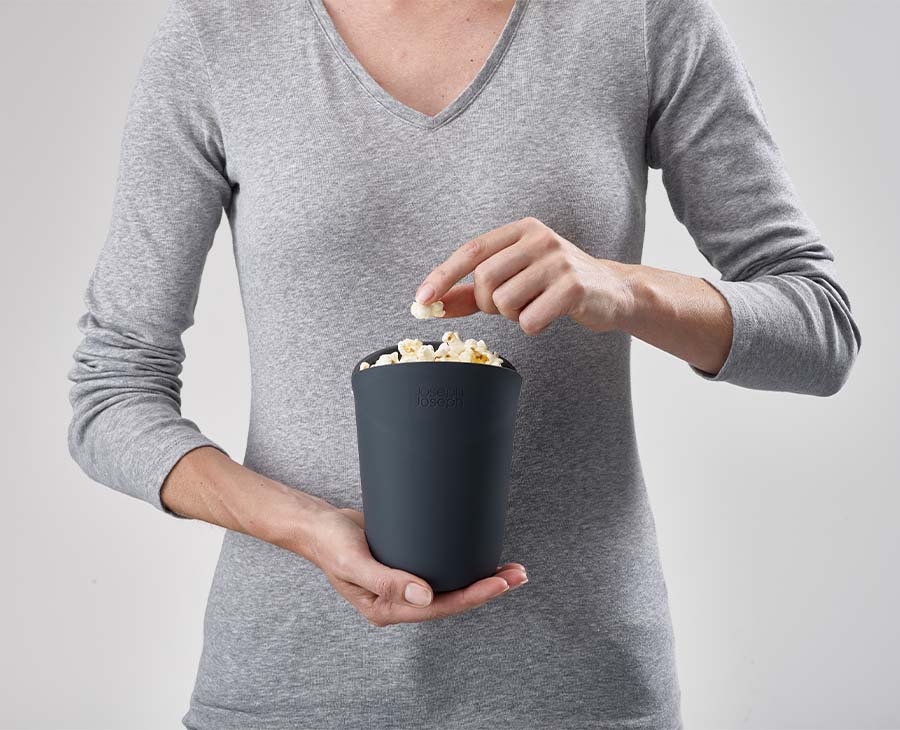Both silicone popcorn cups shown side by side with their lids folded open
