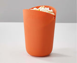 The popcorn cups being shared during a film night