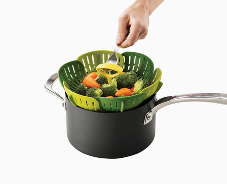 The easy-lift fork hook being used to raise the basket out of the pan