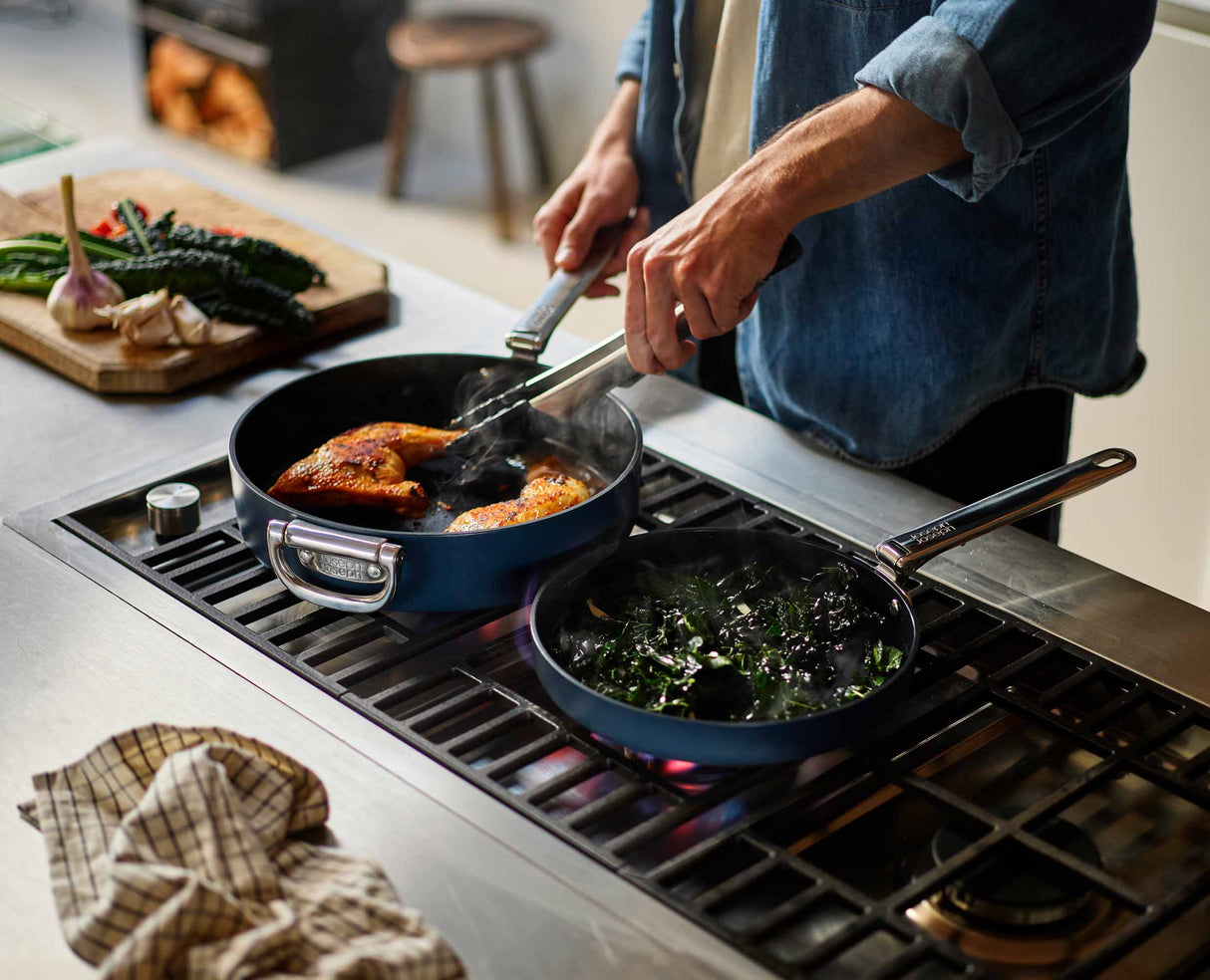 The large Space pan in use on a hob in a modern kitchen