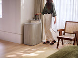 Lid open on the Tota Luxe basket showing the two separate 45-litre tote compartments inside.