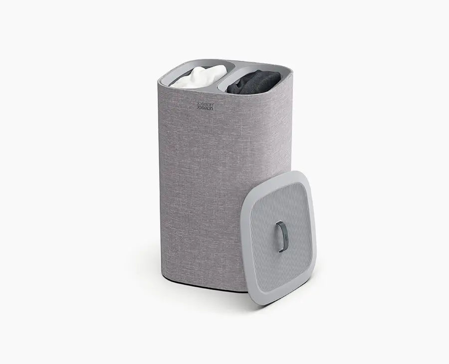 Joseph Joseph Tota 60L laundry basket in grey with the lid closed.