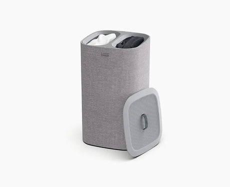 Joseph Joseph Tota 60L laundry basket in grey with the lid closed.