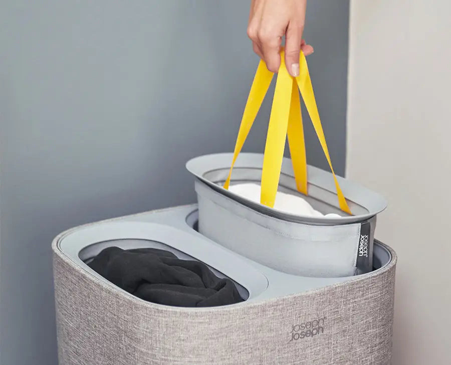 The grey Tota basket with its lid off, showing two 30-litre tote bags inside.