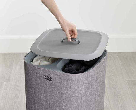 Close-up of the tote bag handles and the plastic rim that holds the bag open.