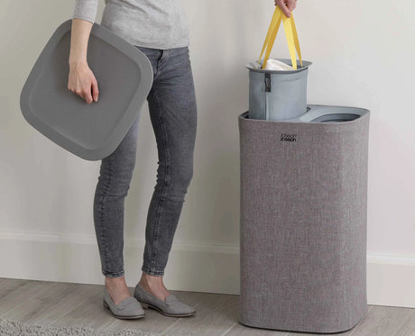 Handle on the base of the bag used to tip laundry into a washing machine.