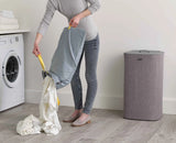 Tota 60L basket shown in a bathroom setting beside a towel rail.
