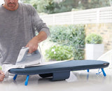 The blue Pocket Plus board folded shut into its compact closed form.
