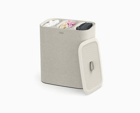 Joseph Joseph Tota Trio 90L laundry basket in ecru with the lid in place.