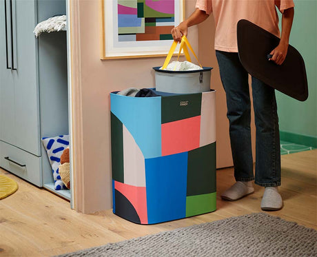 Lid off, showing the two 45-litre tote bags inside the printed basket.